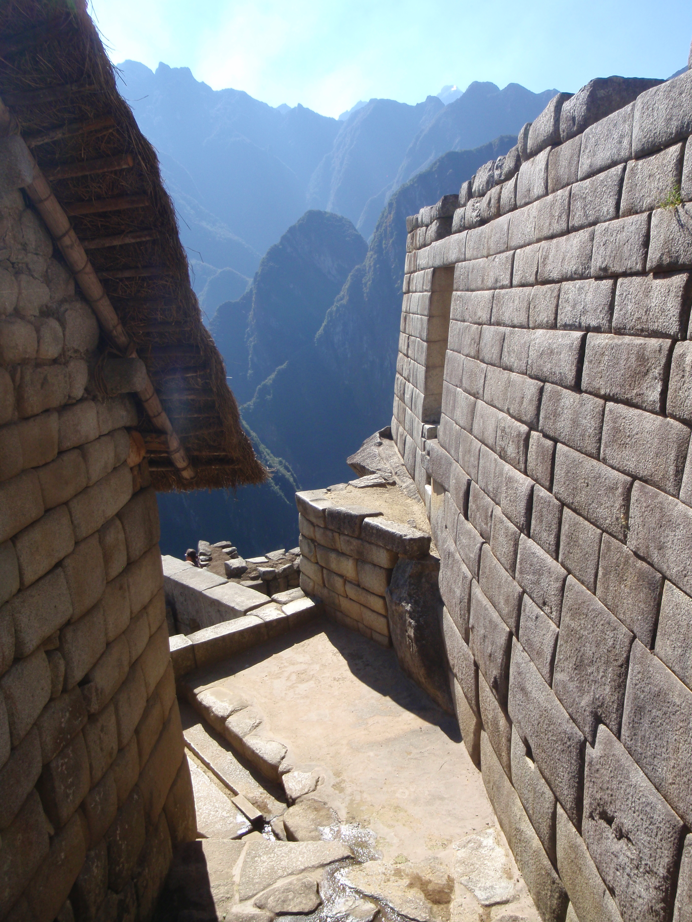 Alley view at Machu Picchu, Peru overlooking the valley below. Image search